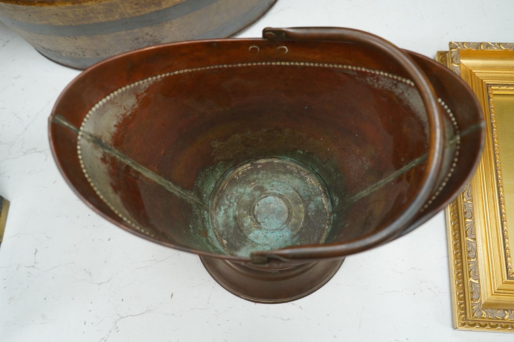 An oval toleware bin and another similar smaller bucket with swing handle, 48cm wide
